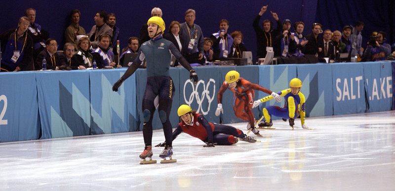 16 Feb 2002: Australia's first ever Winter Gold medal winner Steven Bradbury crosses the line while America's Apolo Anton Ohno scrambles for the line to claim second place after the men's 1000m speed skating final during the Salt Lake City Winter Olympic Games at the Salt Lake Ice Center in Salt Lake City, Utah. DIGITAL IMAGE. Mandatory Credit: Steve Munday/Getty Images